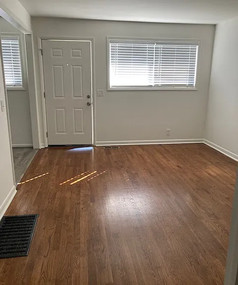 Bright living room opens into kitchen