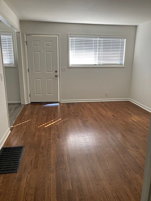 Bright living room opens into kitchen