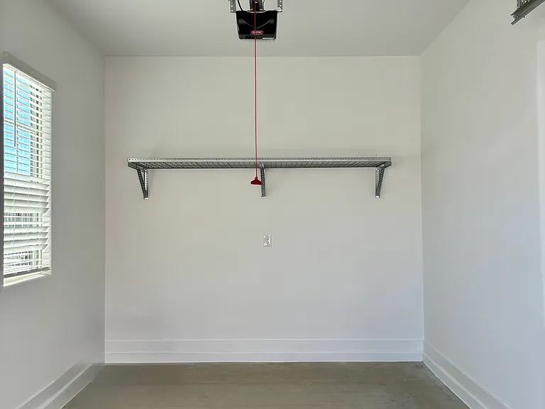 1-car garage with overhead storage.