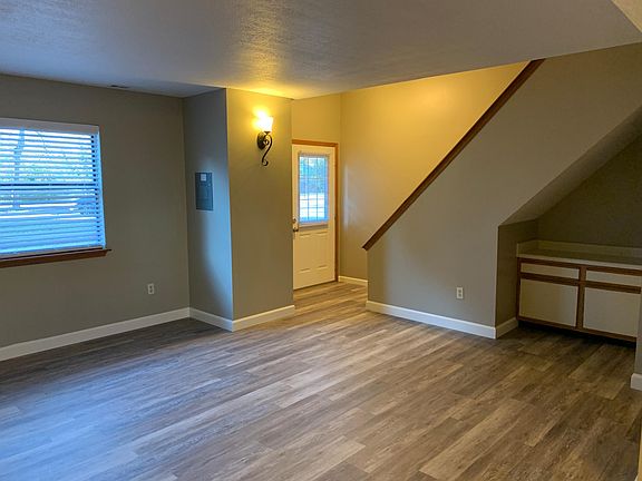 Spacious living room with vinyl plank flooring.