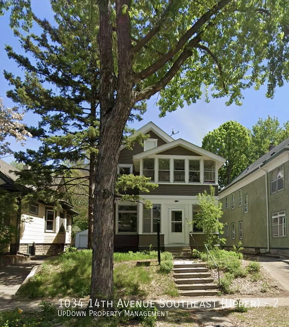 "Charming 2-Bed Upper Unit with Gleaming Hardwood Floors in Vibrant SE Como Neighborhood!" — Photo 1