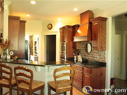 Beautiful brick back splash under venthood.