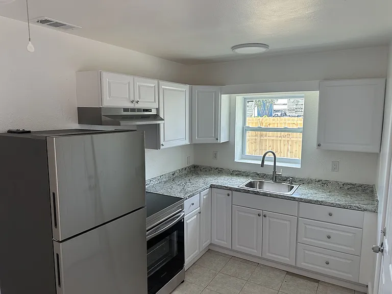 Open kitchen - Brand new EVERYTHING - Window to the fenced in backyard