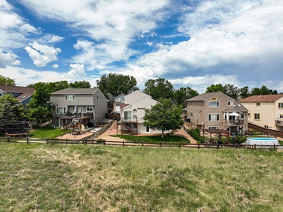 Woodrose back showing open space and adjacent homes.