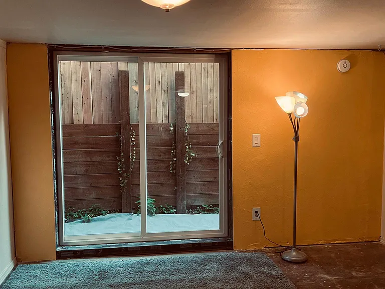 NEW!! LIVING ROOM WITH NEW SLIDING GLASS DOOR LEADING TO SOUTHEND 5X20' COMPLETELY PRIVATE PATIO
