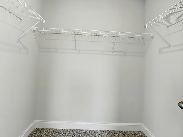 Master Closet - Large Walk-in closet offering generous storage space and built-in shelving.