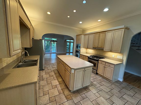 Large kitchen with excellent countertop and storage space, stainless steel appliances, large dining room attached with large breakfast nook