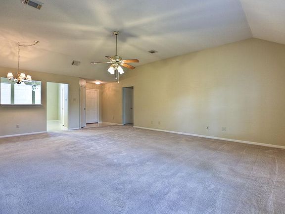 Spacious living room with nice size windows. All carpet has been cleaned and the entire house has a fresh coat of paint.