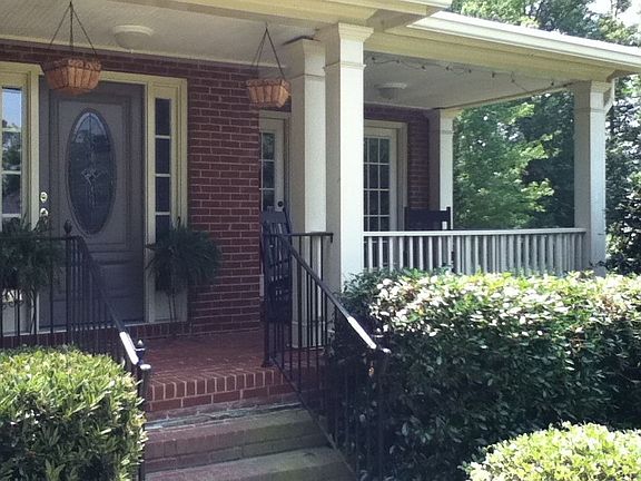 front porch is big and has two doors to office