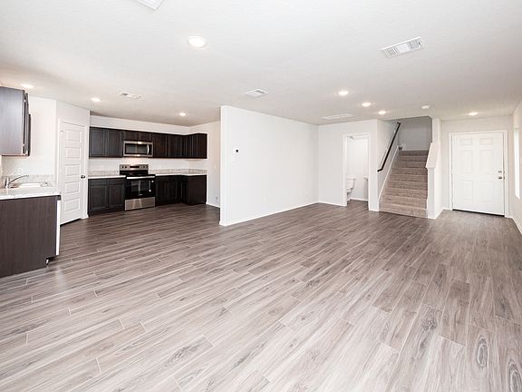 Kitchen and Dining Area to Family Room