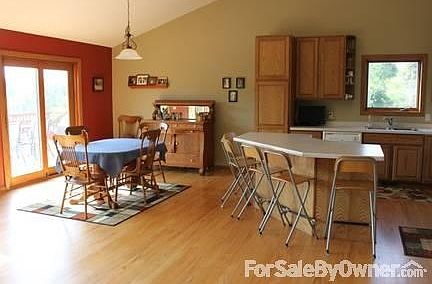 Dining Room and Kitchen
						:
						Kitchen island seats 5 comfortably. Open concept to dining and living room.