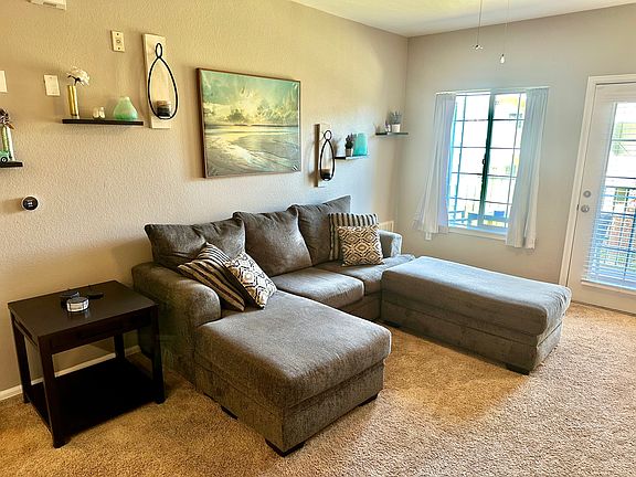 Double chaise sofa with storage and blankets underneath. Unseen but on the other side is a smart TV allowing you to stream non-stop.