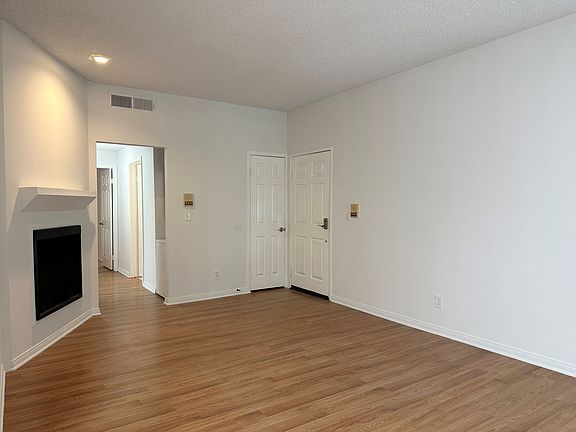 Livingroom with gas fireplace and coat closet