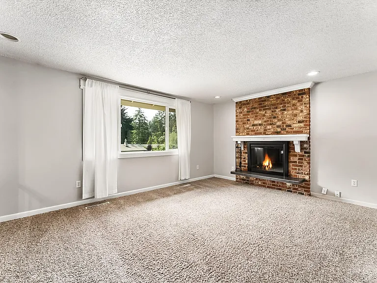 Living Room on upper level. Carpet has been replaced with new LVP Flooring.
