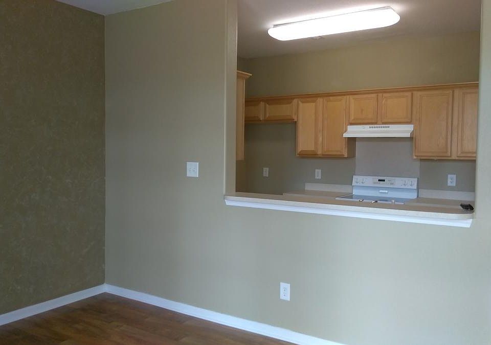 Living room with view toward kitchen