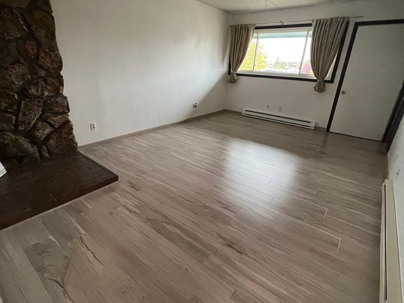 Living Room With brand new Windows, Flooring, Window Coverings. and Fresh Paint throughout