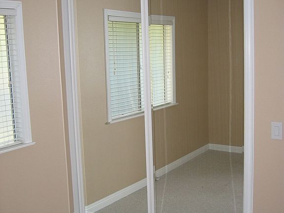 Upgraded framed mirrored closet doors