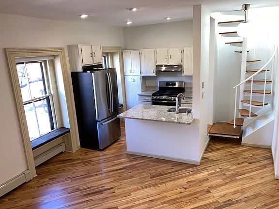 Kitchen & spiral staircase for private access to roof