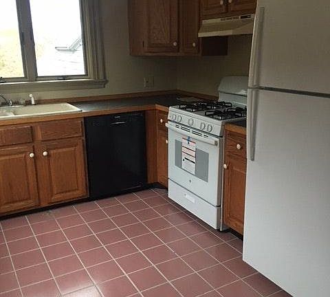 Kitchen with new stove and refrigerator