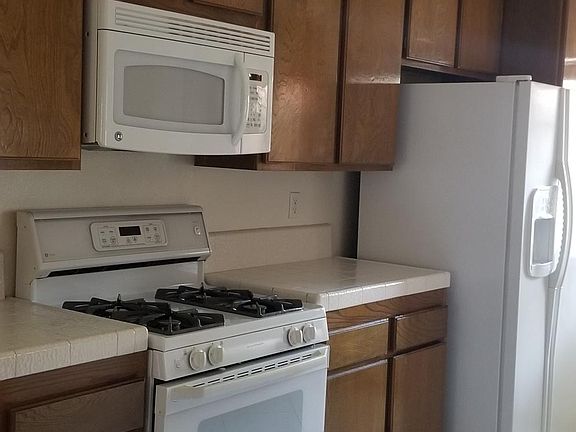 Kitchen includes: microwave, stove, refrigerator, dishwasher