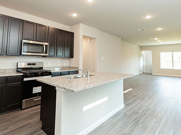 Kitchen to Dining Area and Family Room