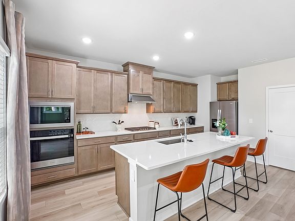 Kitchen in the Wilson floorplan at a Meritage Homes community in Zebulon, NC.