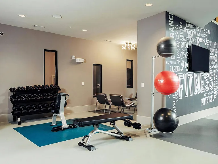 Gym Studio Featuring Adjustable Machines and Open-Use Workout Space