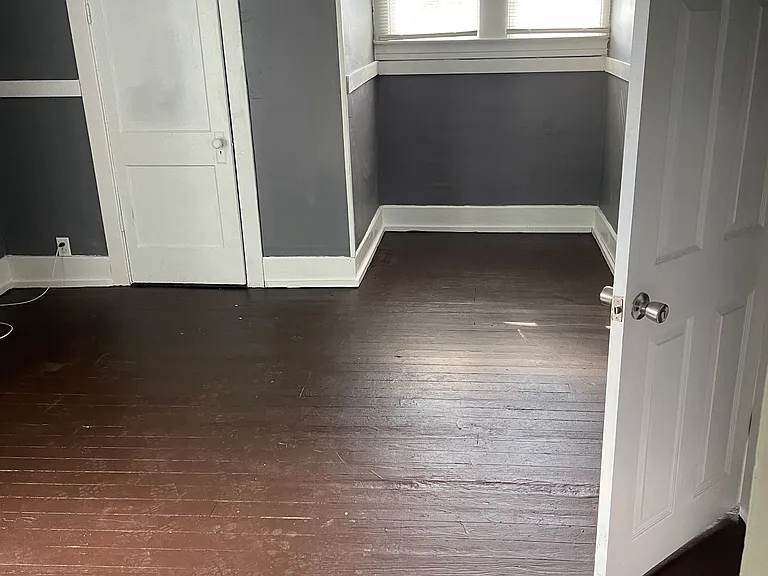 Left Upstairs Bedroom from Doorway with Hardwood Floors showing Closet Door