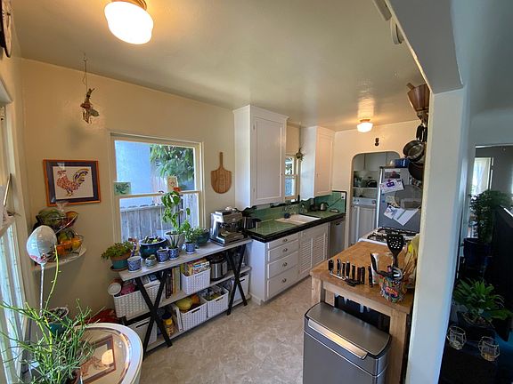 New floors in the kitchen and newly painted cupboards.