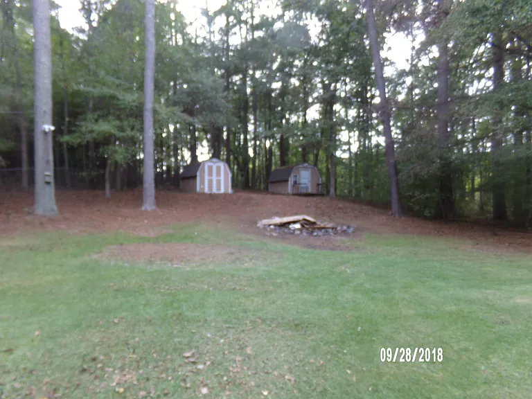 Yard and 2 outdoor buildings