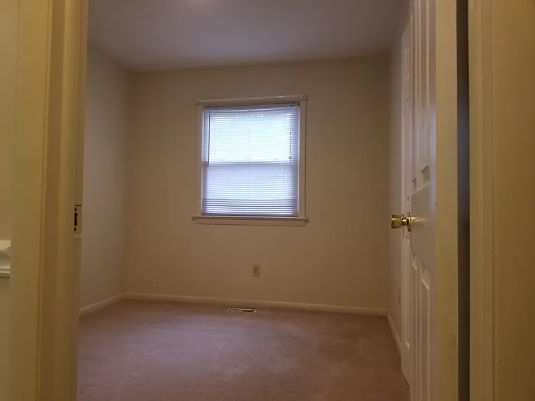 Third bedroom has one window (facing street).