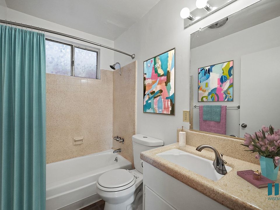 Bathroom with Shower Bath, Window, and Vanity Cabinet Storage