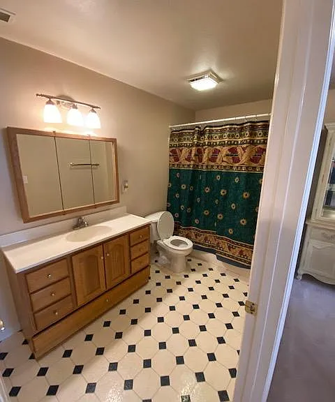 Full Bathroom with tub and shower and sink vanity