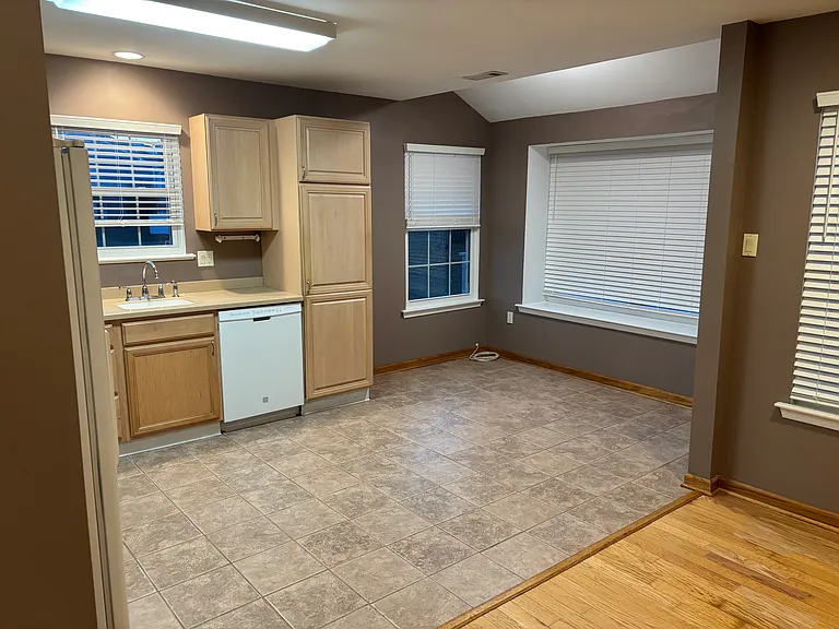 Bright kitchen bump out with entrance to rear deck! Bay window sitting area.