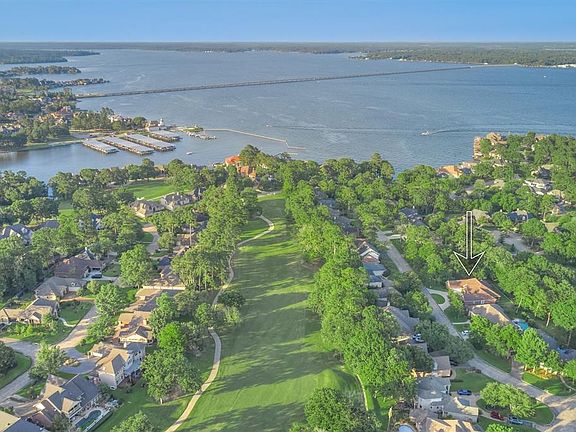 Located on a quiet street in the serene subdivision of Bentwater on Lake Conroe.