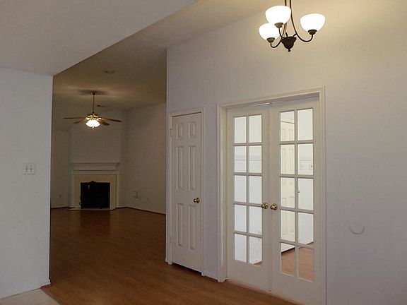 View of hallway off entry shows french doors to 4th bedroom! This could also be a study!