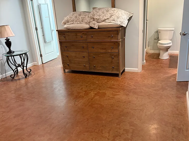 Larger bedroom showing ensuite bath and walk in closet. Furniture not included.