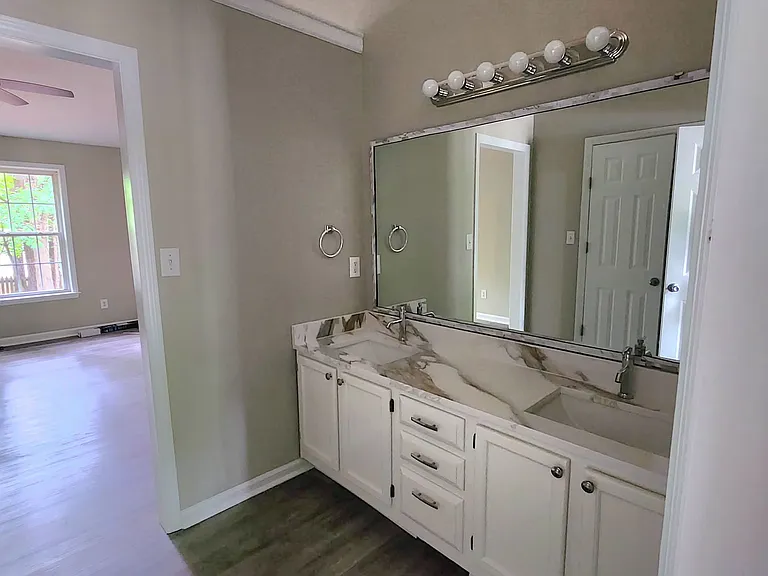 View from ensuite bath into master