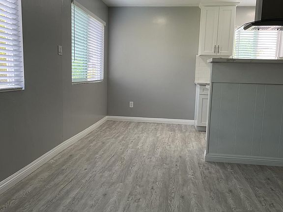 Living room view of dining area/breakfast nook and seating area