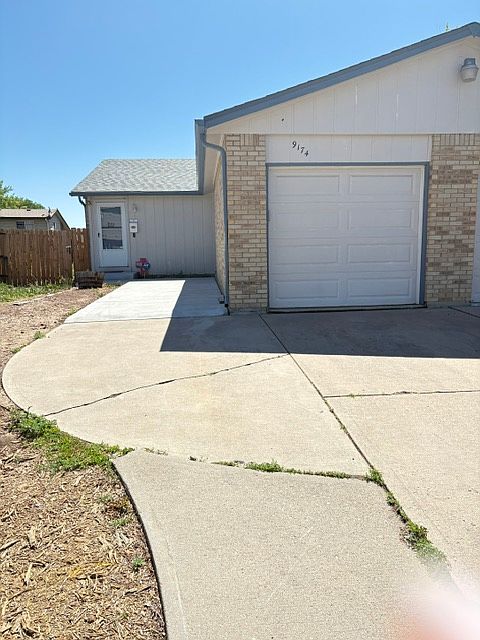 Front entrance and one-car garage
