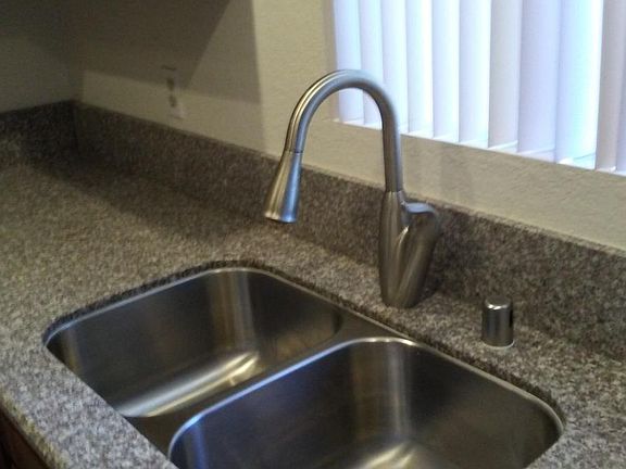 Kitchen-Moen faucet on granite countertop