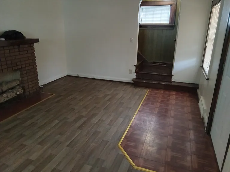 living room viewing upstairs staircase