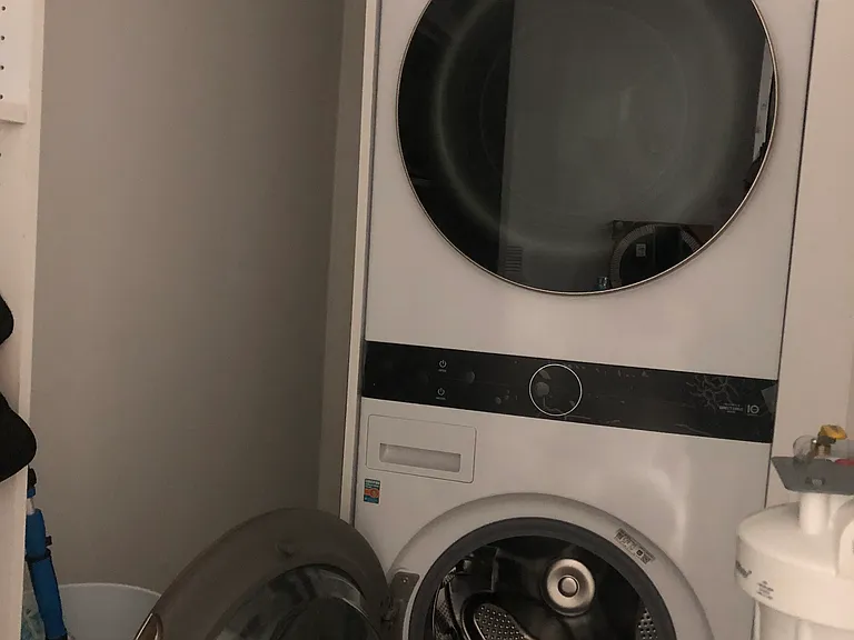 Full size washer and dryer within the condo