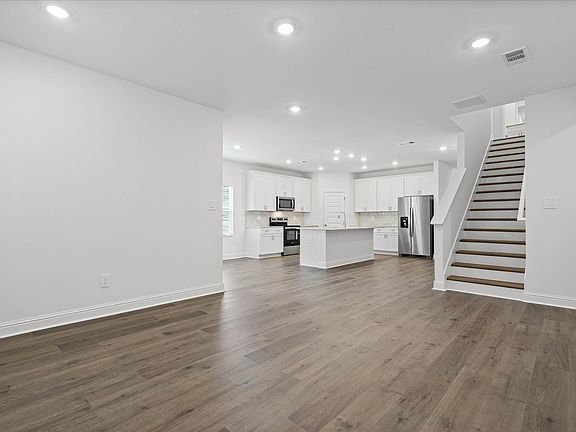 Great Room in the Northbrook floorplan at a Meritage Homes community in Ocean Springs, MS.