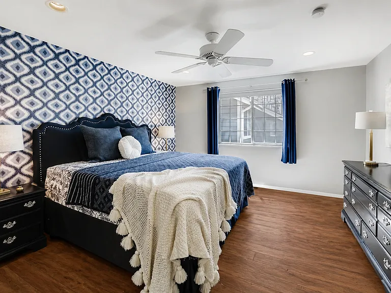 Master bedroom with new luxury vinyl flooring.