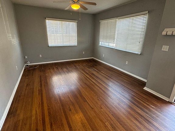 Living room. 18x11 and has a ceiling fan/light. The space has new 2" window blinds