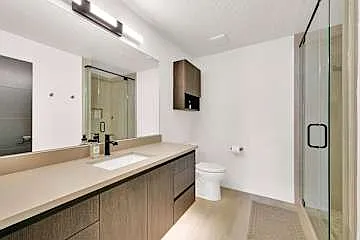 Second full sized bathroom with walk in shower. Accessible from the hallway.