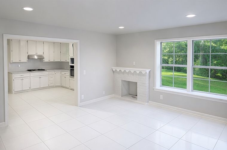Open floor plan into the kitchen with granite counter tops