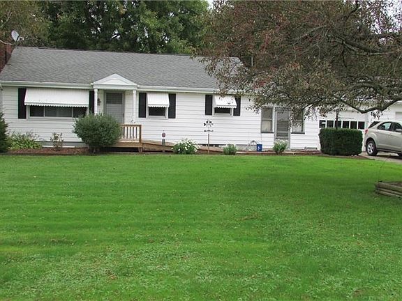 Front exterior of the house.  Breezeway and a 2 car garage.
