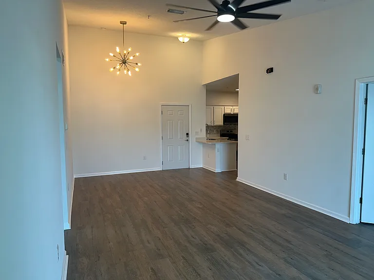 Entrance Door into open concept condo. Cathedral Ceiling, Dining Area
View of Kitchen
